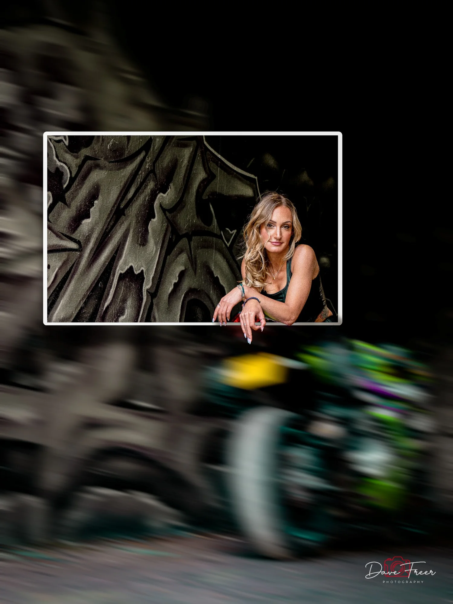 Creative portrait with motion-blurred motorcycle